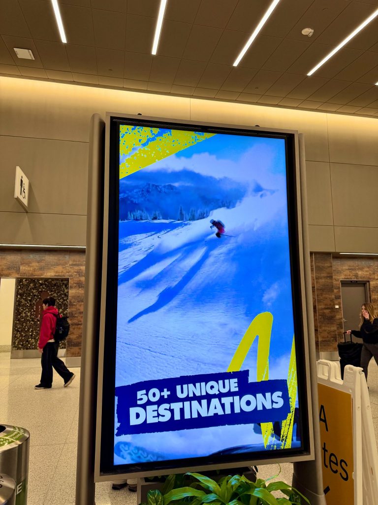 photo of an ikon pass ad in an airport hallway